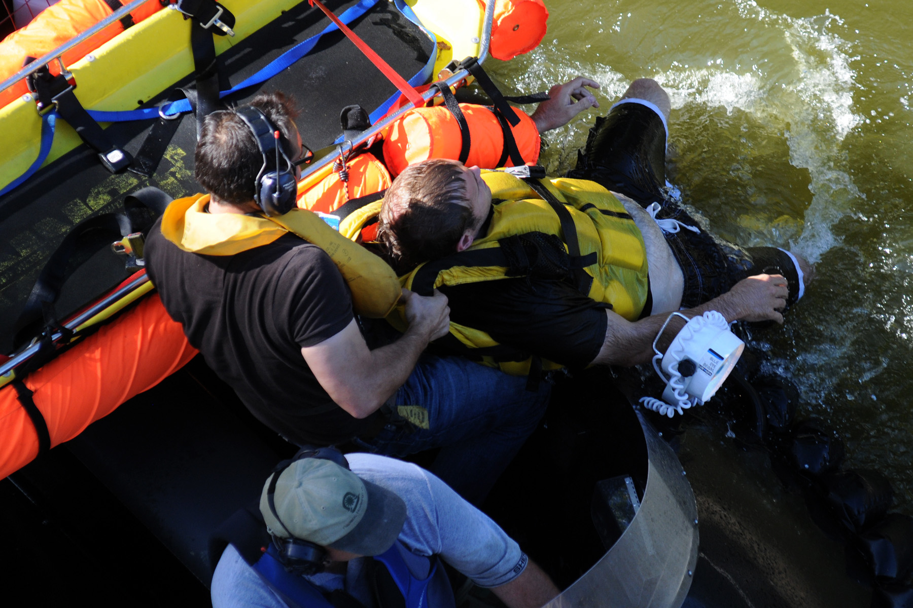 Victim is lifted into the stable Hovercrat and positioned in a Junkin basket for transportation and safety.
